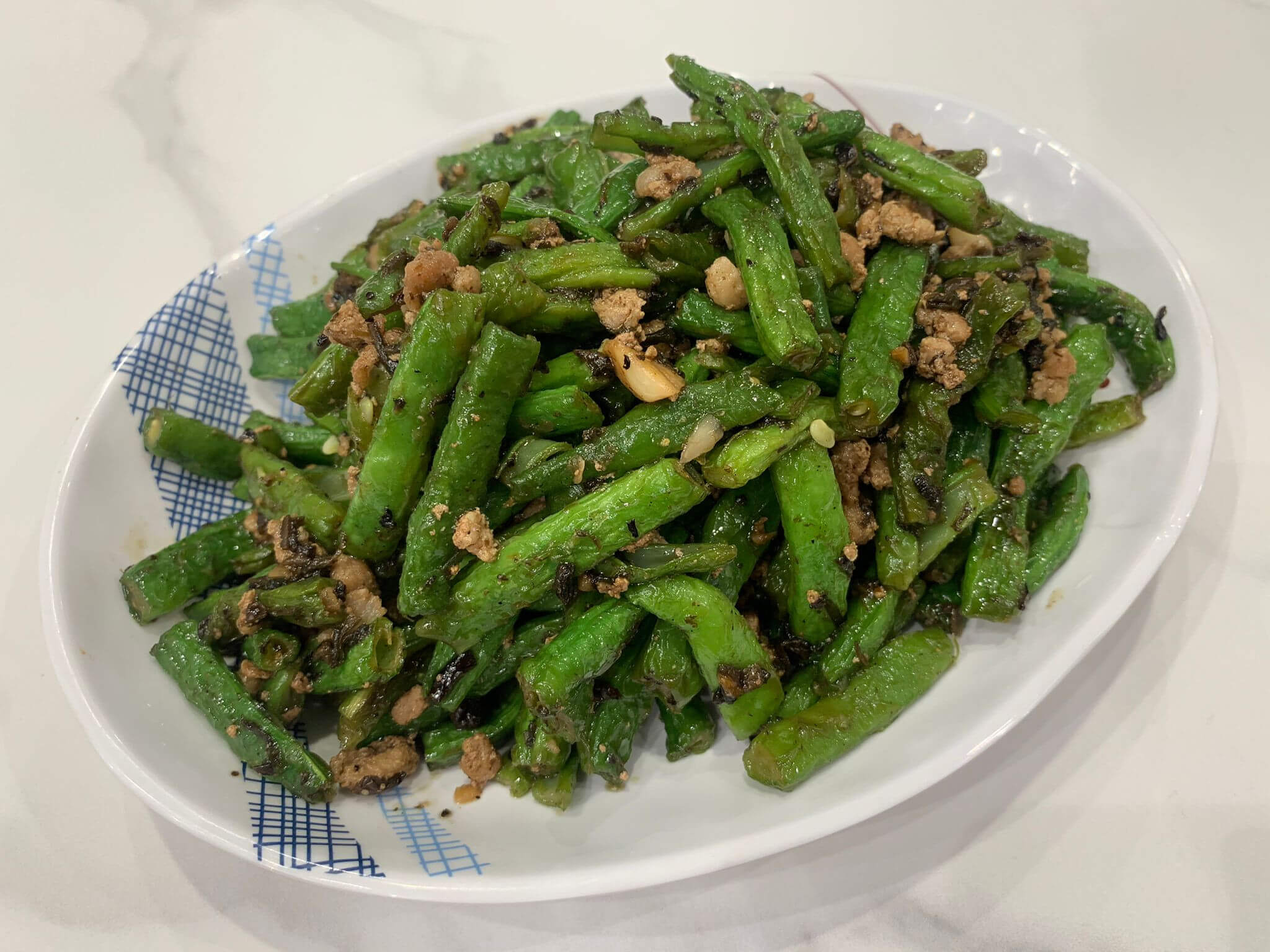 欖菜肉碎炒四季豆香口又有營養。