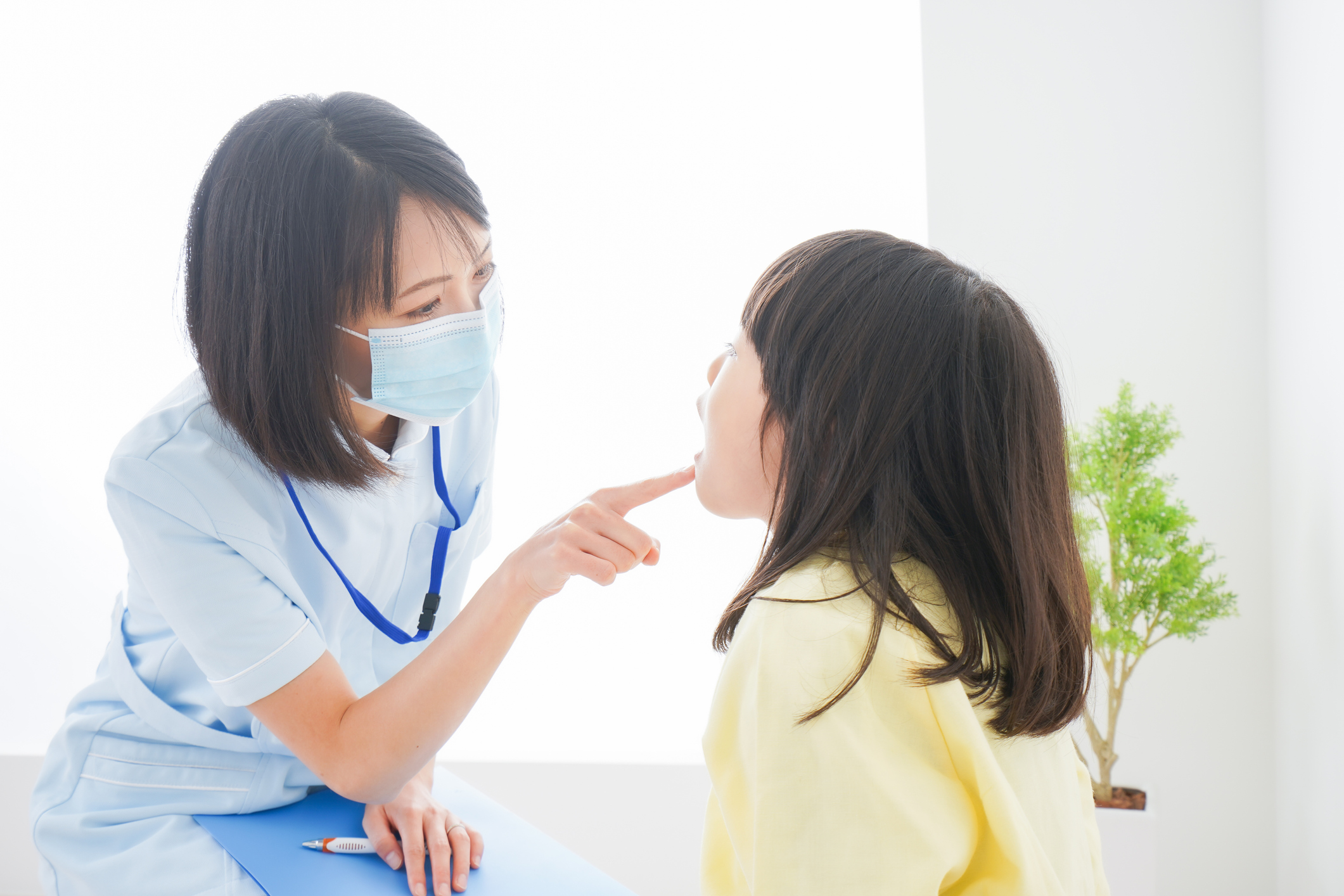 A little girl being treated by a dentist