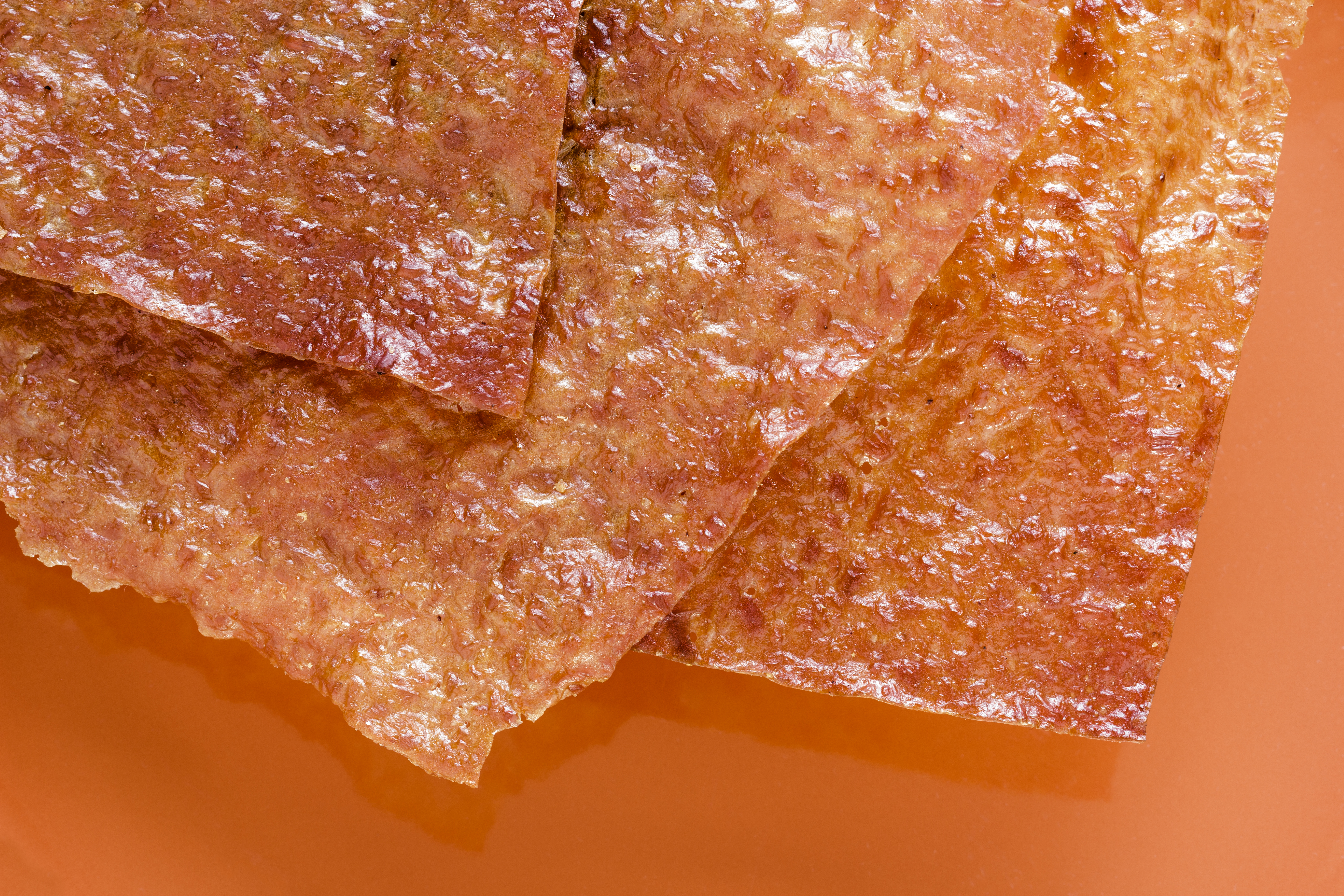 Sliced sheets of dried and crispy pork.